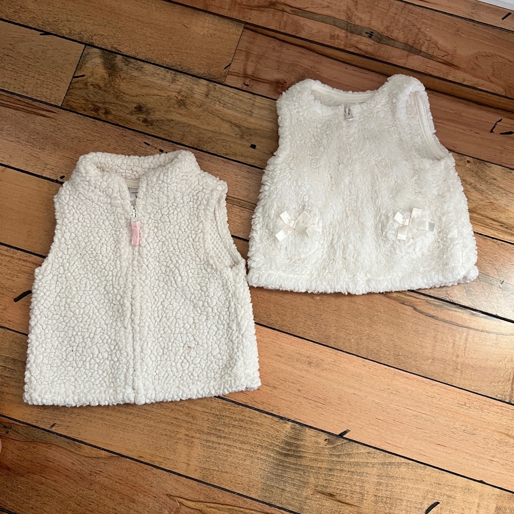 2 carters newborn fleece zipper vests